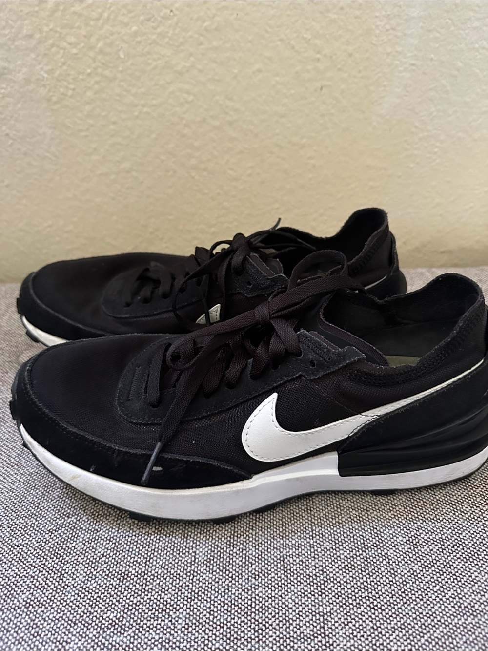 Nike women’s Black Low-Top Sneakers with White Swoosh